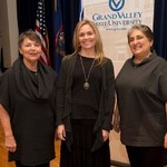 Three women pose for a photo